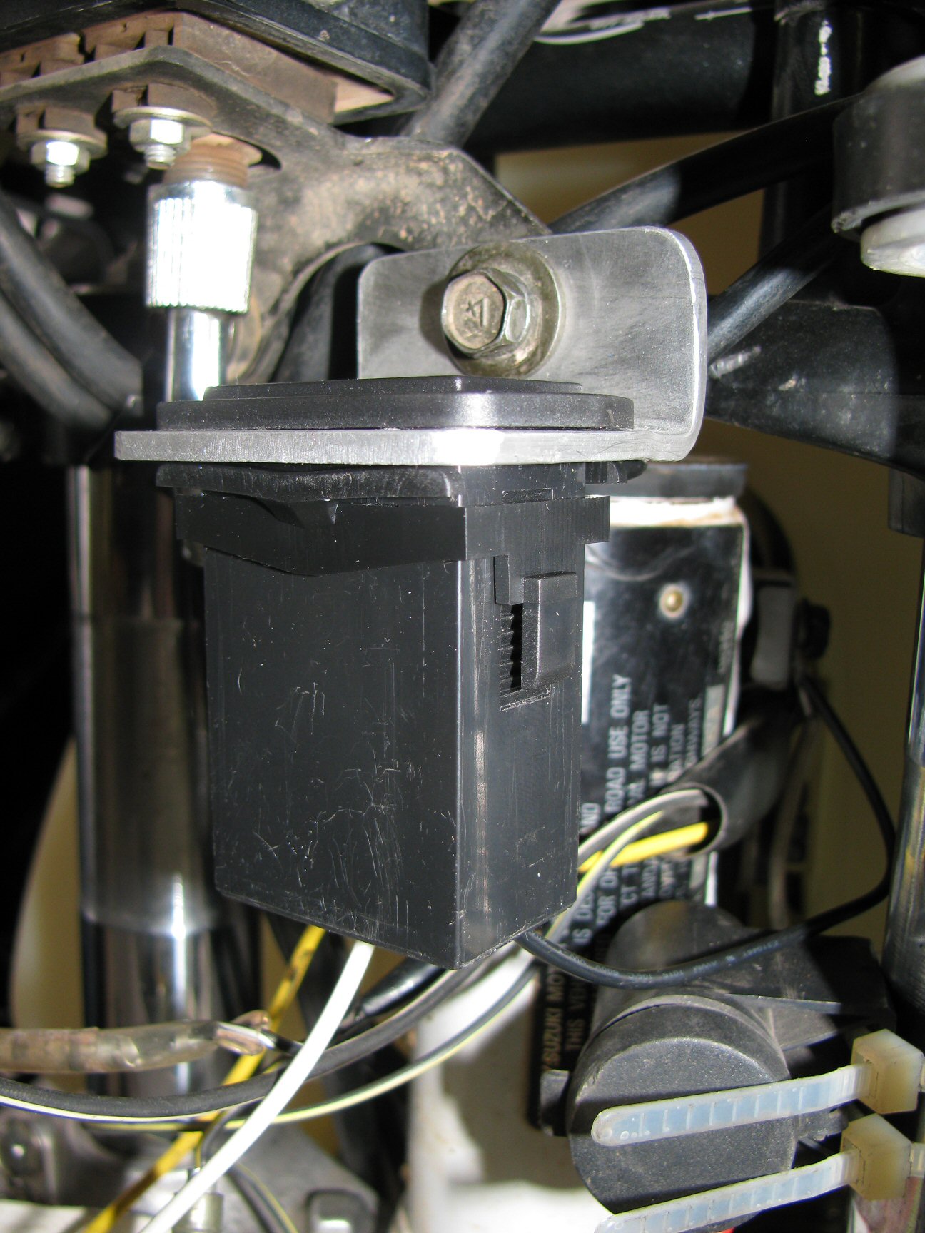 Pro Power Hour Meter installed on a 1993 Suzuki DR350 dirt motorcycle.