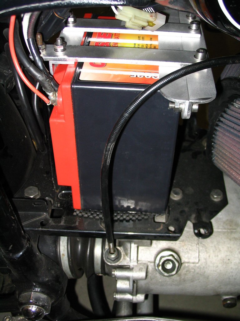 View of the right side of the battery installed with the bracket in place. Applicable to Moto Guzzi V700, V7 Special, Ambassador, 850 GT, 850 GT California, Eldorado, and 850 California Police motorcycles.