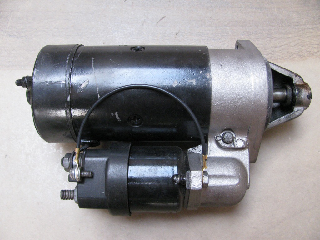 The short black wire with two ring terminals grounds the starter solenoid to the starter body.