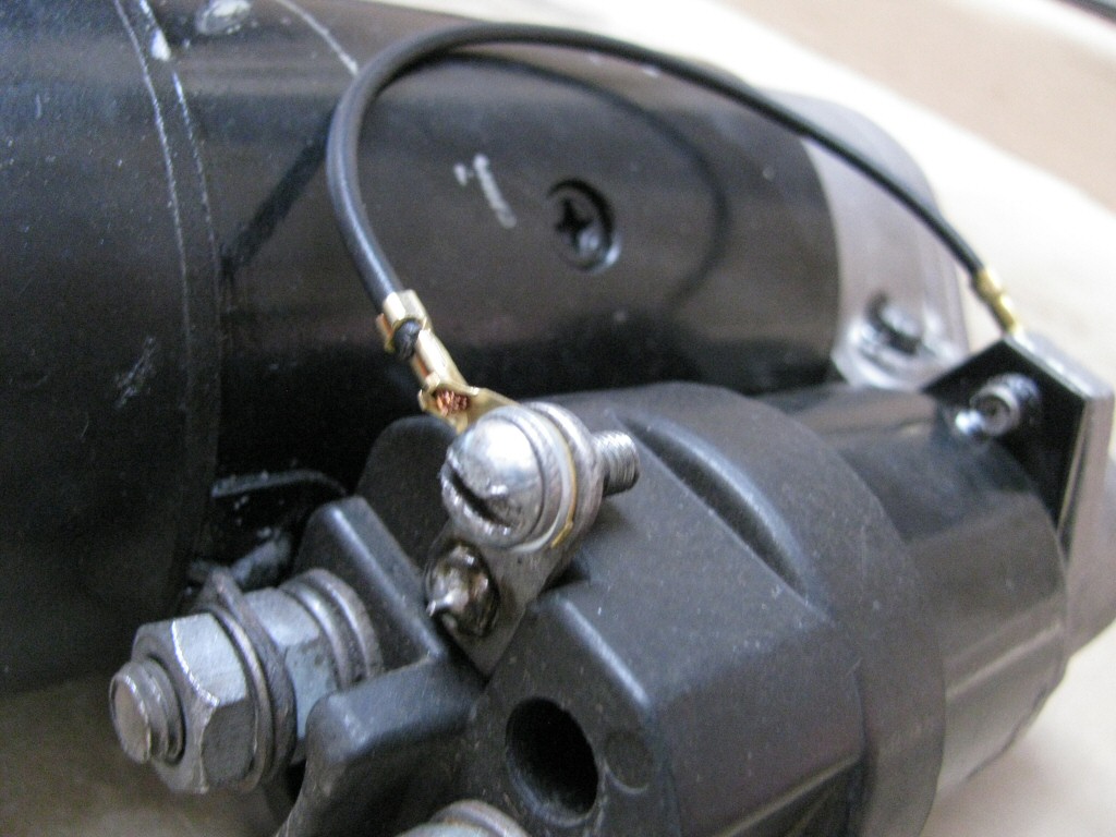 The 5 mm ring terminal is secured to the starter solenoid.