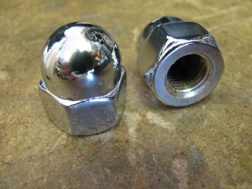 Chrome plated, single piece acorn nuts.