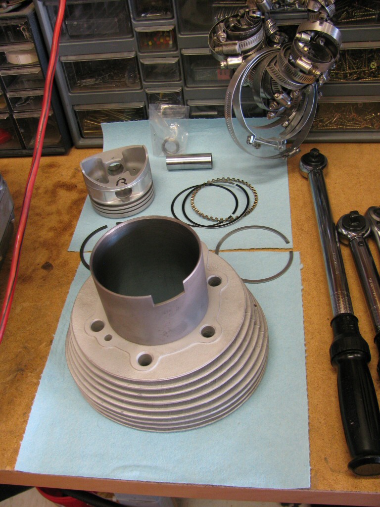 The right cylinder, piston, rings, wrist pin, and circlips.