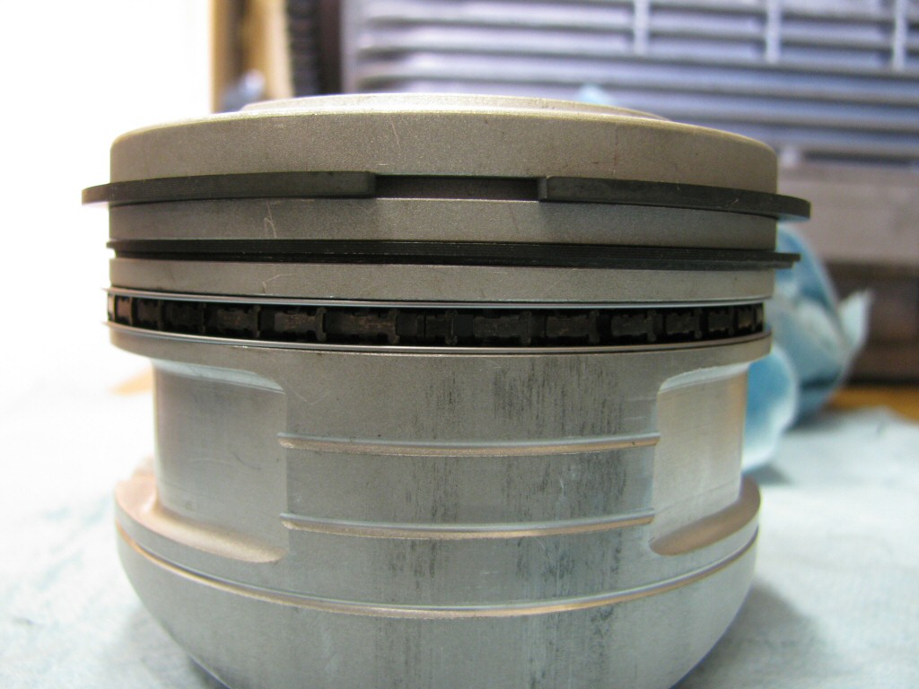 Rings fit to the left piston. This series of photos is intended to show the careful ring gap placement, as per the instructions provided by the piston ring manufacturer (TotalSeal).