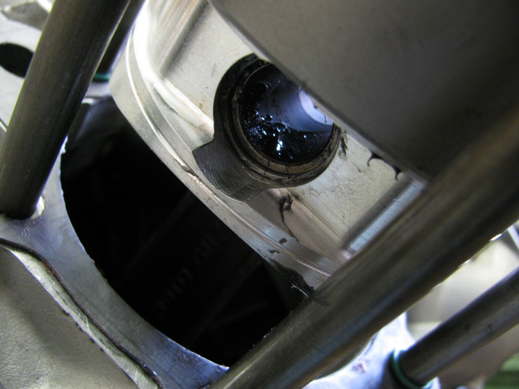 A closer view of the circlip in place on the front side of the piston.