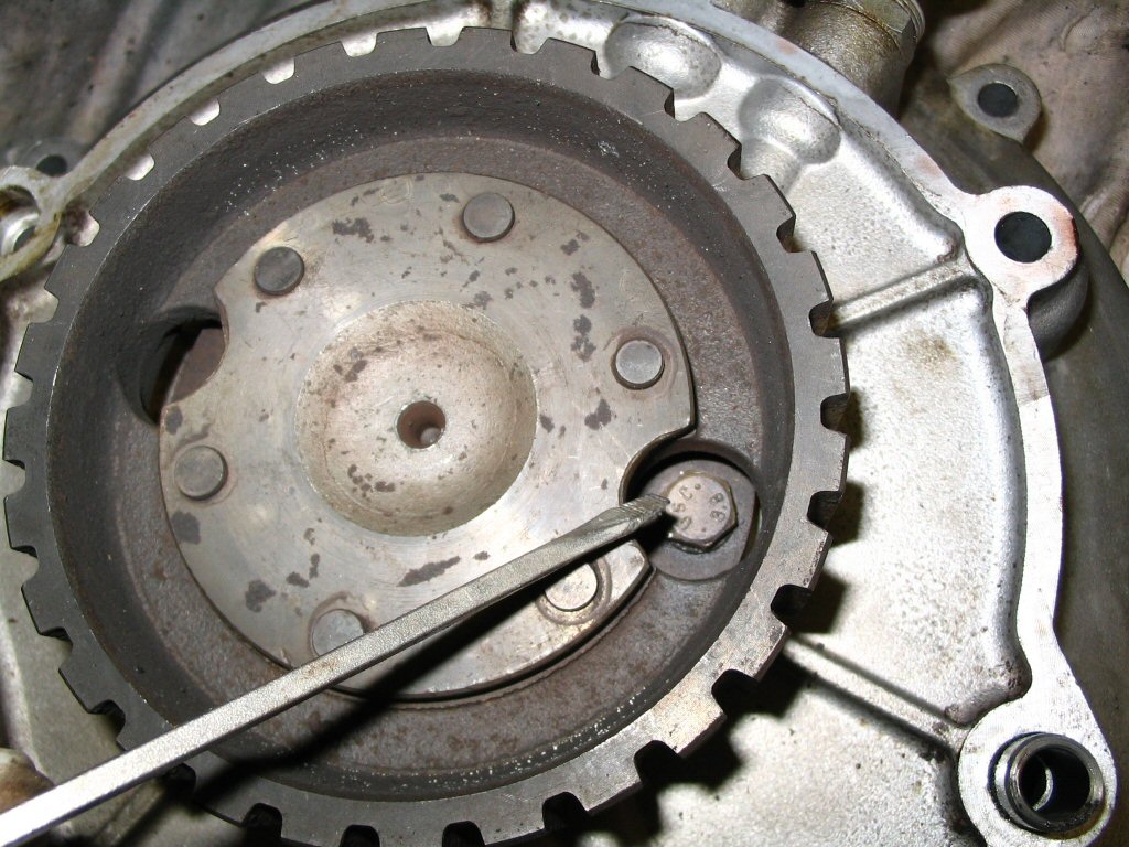 In order to remove the clutch input hub assembly from the convert cover, you need to remove 5 bolts. Rotate the clutch input hub until the bolts are visible through the access holes.