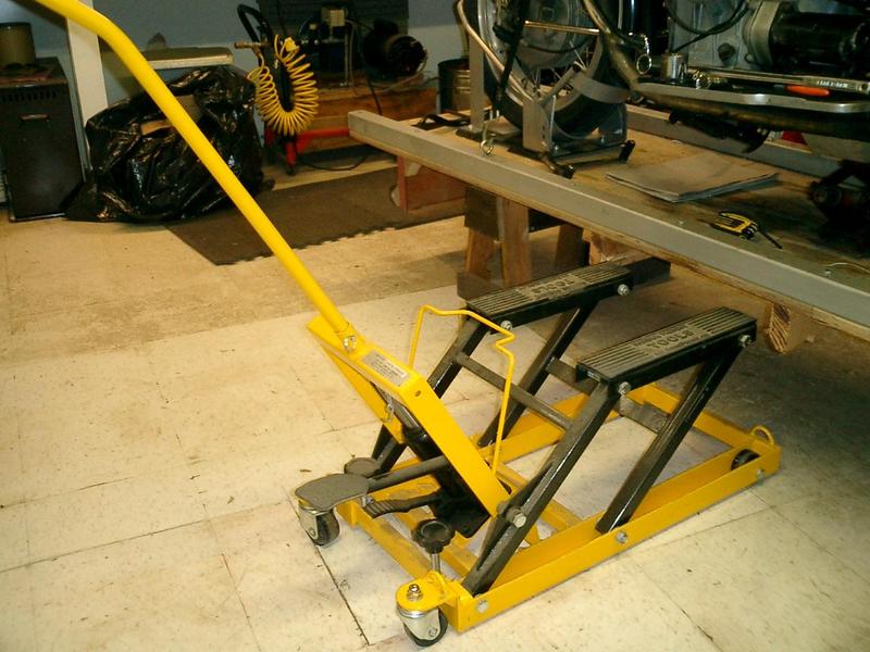 Harbor Freight bike jack about to slide under the bike platform.