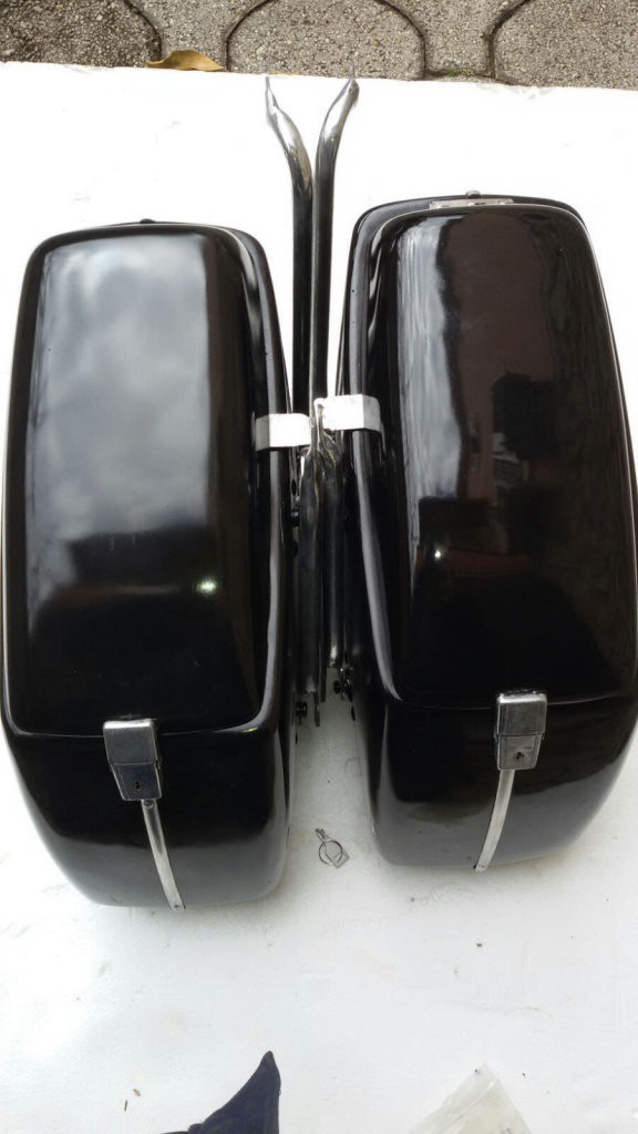 Original Moto Guzzi saddlebags that have had the handles removed from the lid (smaller).