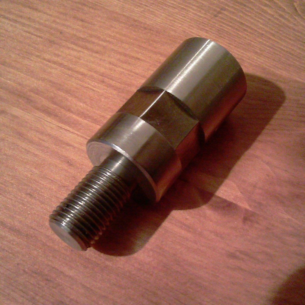 Rear shock spacer for mounting Wixom saddlebag brackets.