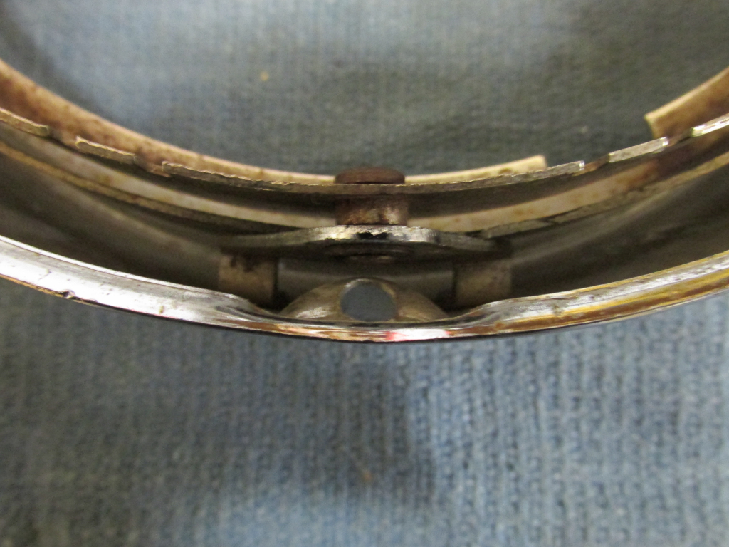 Bottom pivot point. Moto Guzzi headlight as commonly fit to many 1970's Tonti models.