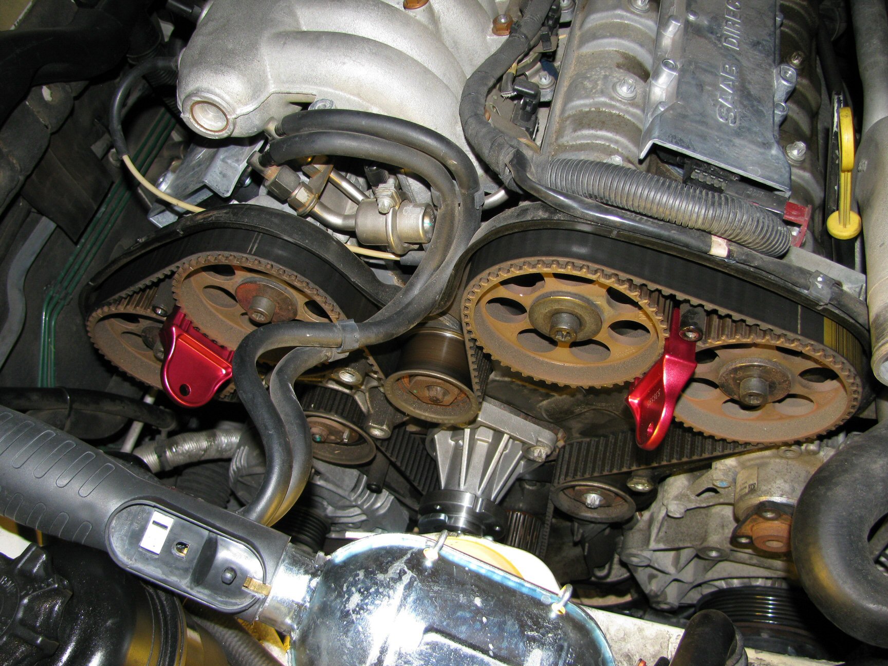 Timing belt and pulleys exposed. Camshaft pulleys 1 (left) through 4 (right).