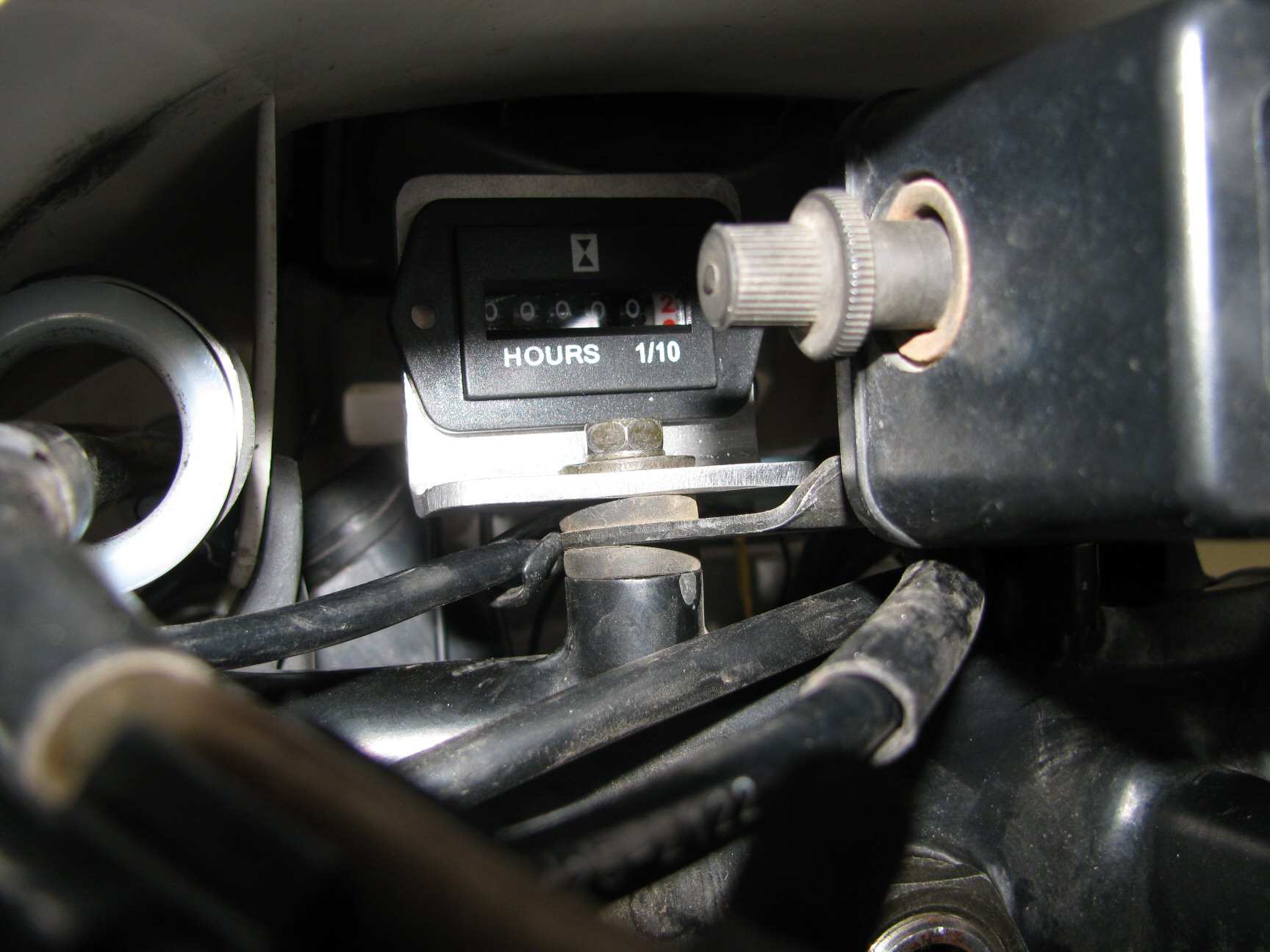 Pro Power Hour Meter installed on a 1993 Suzuki DR350 dirt motorcycle.