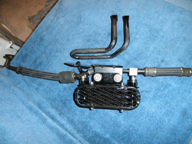 Original oil cooler parts for a Suzuki DR350.