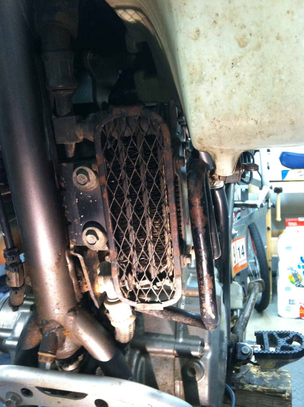 Original oil cooler installed on a Suzuki DR350.