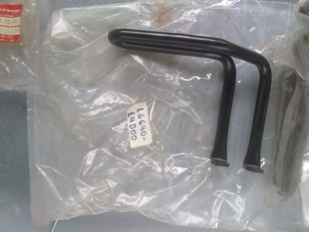 Original oil cooler parts for a Suzuki DR350.