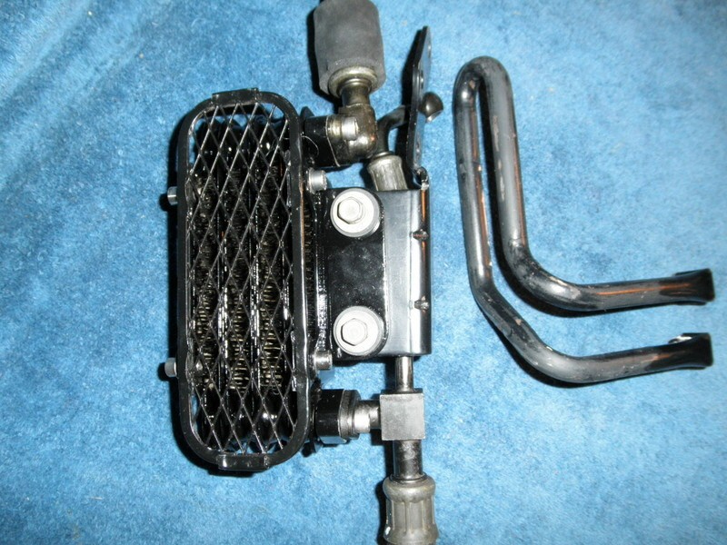 Original oil cooler parts for a Suzuki DR350.