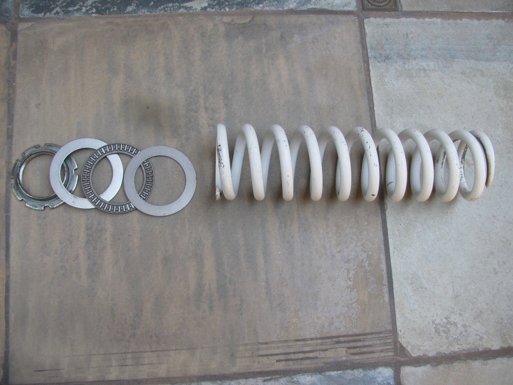 Needle roller thrust bearing used to ease shock preload adjustments on a Suzuki DR350.