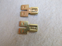 Side by side adapter to connect two 6.3 mm female spade terminals to a single male spade terminal