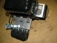 The bracket mounted to the voltage regulator bracket.