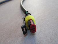 2-pin AMP Superseal connector to the left S coil (green wire).