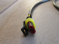 2-pin AMP Superseal connector to the right D coil (yellow/black wire).