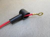 Rubber boot/cover shown in use with a 12 AWG wire and a 6 mm ring terminal. (MG# 12702900-ALT).