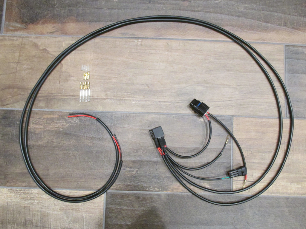 Plug-in-ready, relay-equipped harness for adding auxiliary lights for non-OEM LED lights on the Moto Guzzi V100 Mandello.