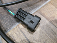 Connection to the three pin OEM Moto Guzzi wiring harness connector located under the seat.