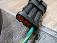 Connection to the three pin OEM Moto Guzzi wiring harness connector located under the seat.