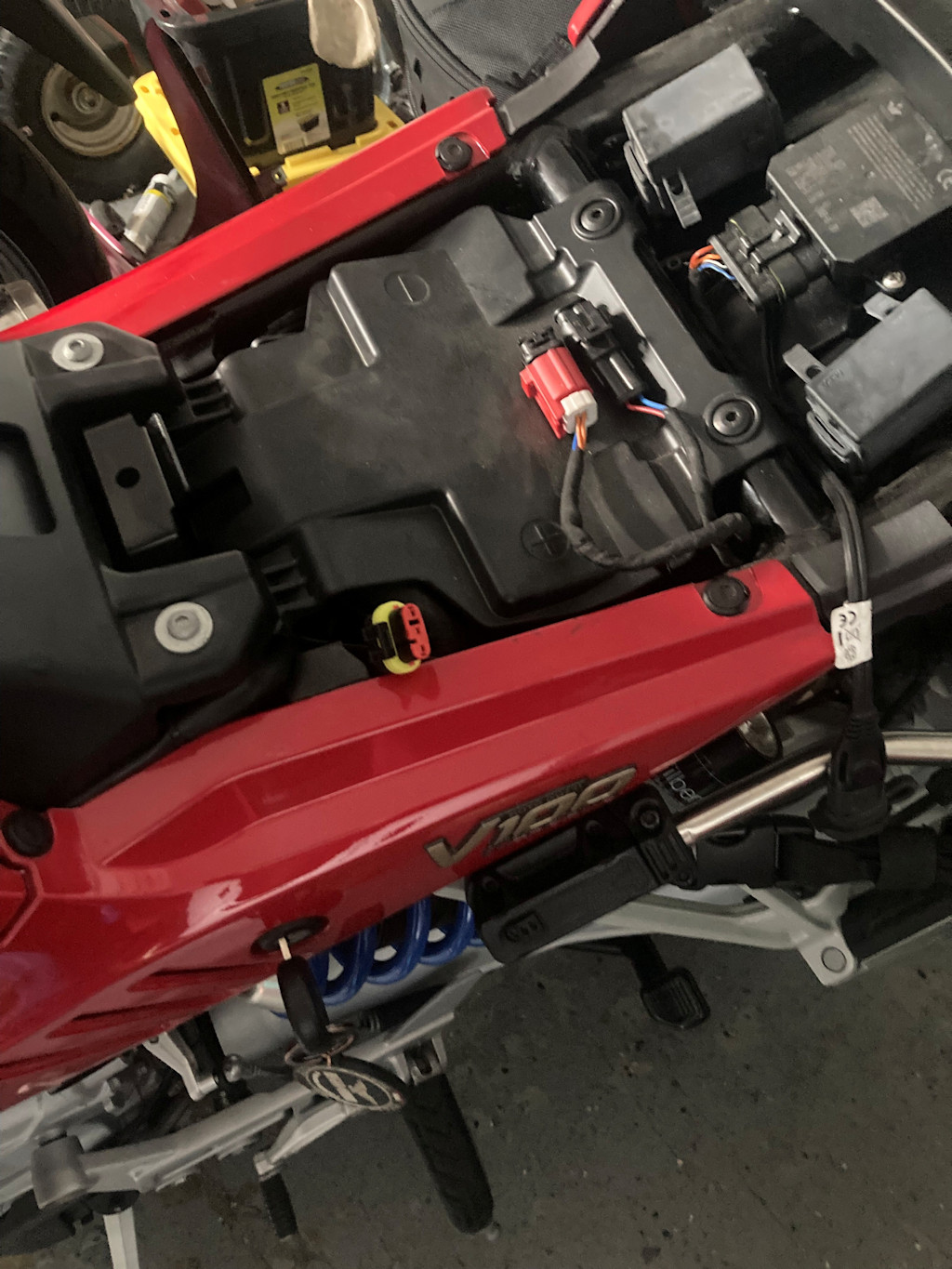Seat lifted with view of 3-pin connector.