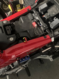 Seat lifted with view of 3-pin connector.
