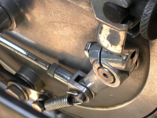 Added spring to help return the rear brake to the non-applied position after braking. I did not find this necessary on my 850 T rear brake.