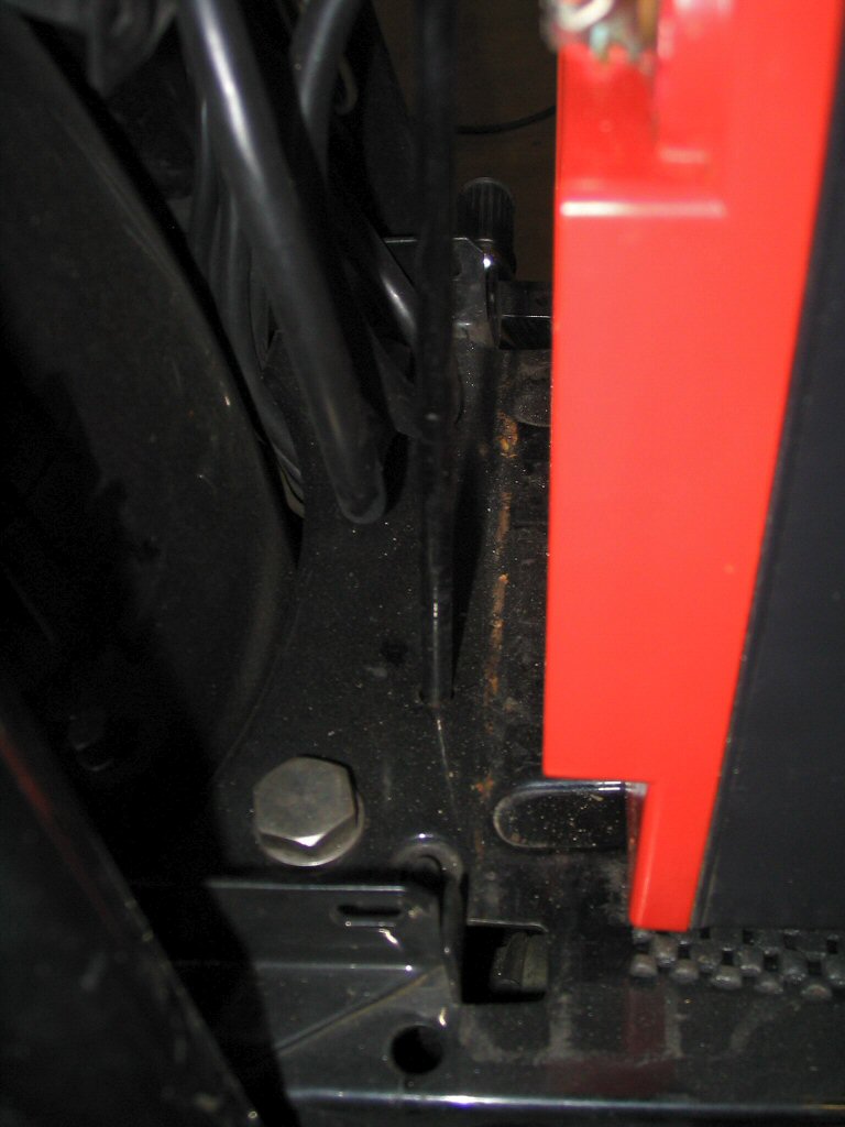 View of the right side L-shaped bolt in the reversed position using the standard holes. The L-shaped bolt can easily be installed in this reversed position by inserting it up from the bottom to the left of the drive shaft. Applicable to Moto Guzzi V700, V7 Special, Ambassador, 850 GT, 850 GT California, Eldorado, and 850 California Police motorcycles.