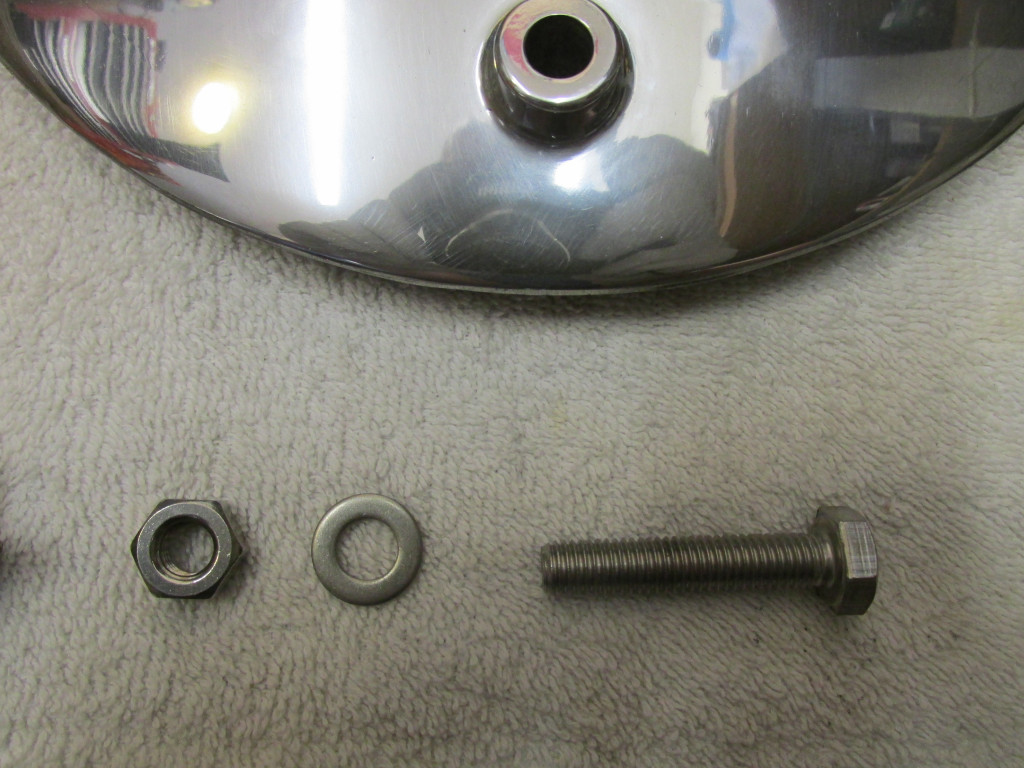 I start by fitting the bolt that secures the rear brake stay to the rear brake plate.