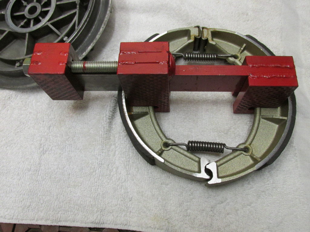 Here is Stephen Brenton's excellent brake shoe spreader tool in place. Please note the orientation of the springs. The open ends of the springs facing down/away from the wheel hub to avoid any risk of them spreading wide and coming into contact with the rotating wheel.
