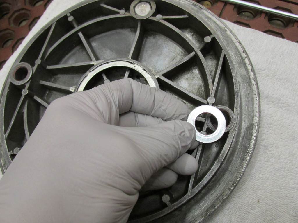 Make sure to place the flat washer in place on the pivot that rotates within the brake plate.