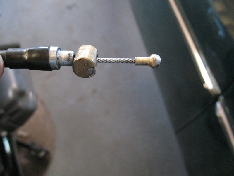 A completed cable end (pen refill stub soldered onto inner cable).