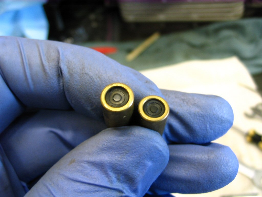 This is the sealing surface of the choke (enricher) plungers. New plungers have a flat sealing surface that has not been indented by years of constant spring pressure. While these may function fine, I will not reuse them. New ones are inexpensive and easily replaced. Adam S. recommends the following technique to extend the life of the plungers: One trick that I use, and it works fine, is to remove the rubber plug from the choke plunger, using a small dental pick. Flip the rubber piece over and you'll have a nice new sealing surface.