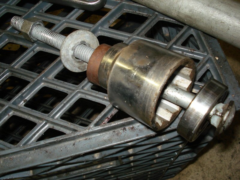 U-joint carrier bearing removal: Aftermath with the bearing on the carriage bolt.