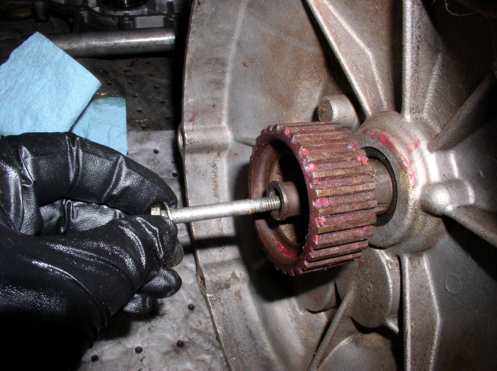 Insert an 6 mm × 50 mm (or so) bolt into the front of the transmission.