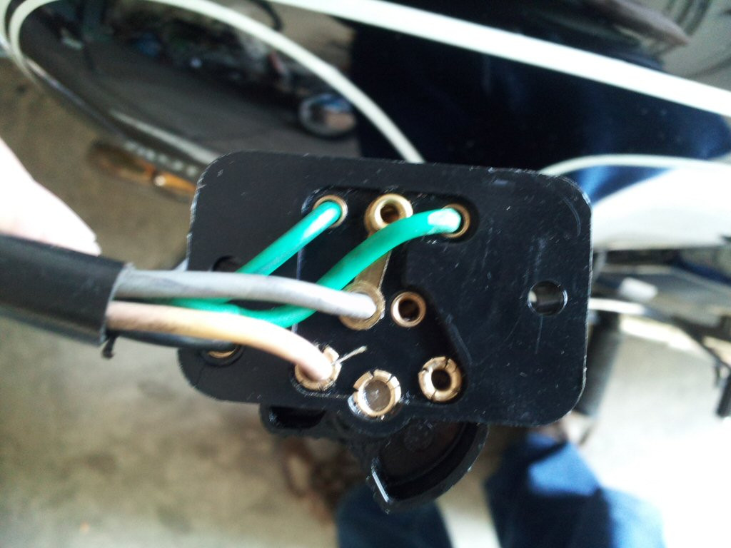 Connections at the rear of a no solder required switch as sold by MG Cycle. Original wires with faded colors shown.