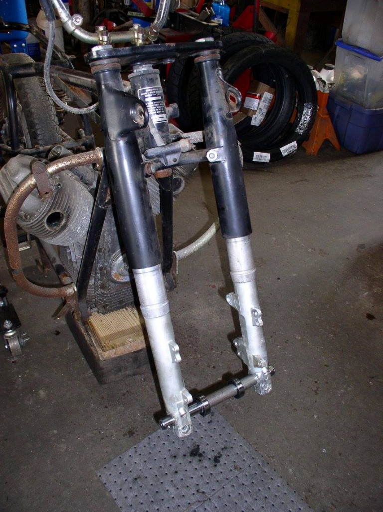 Pair of forks assembled for test fitting. Axle, spacers and bearings also.