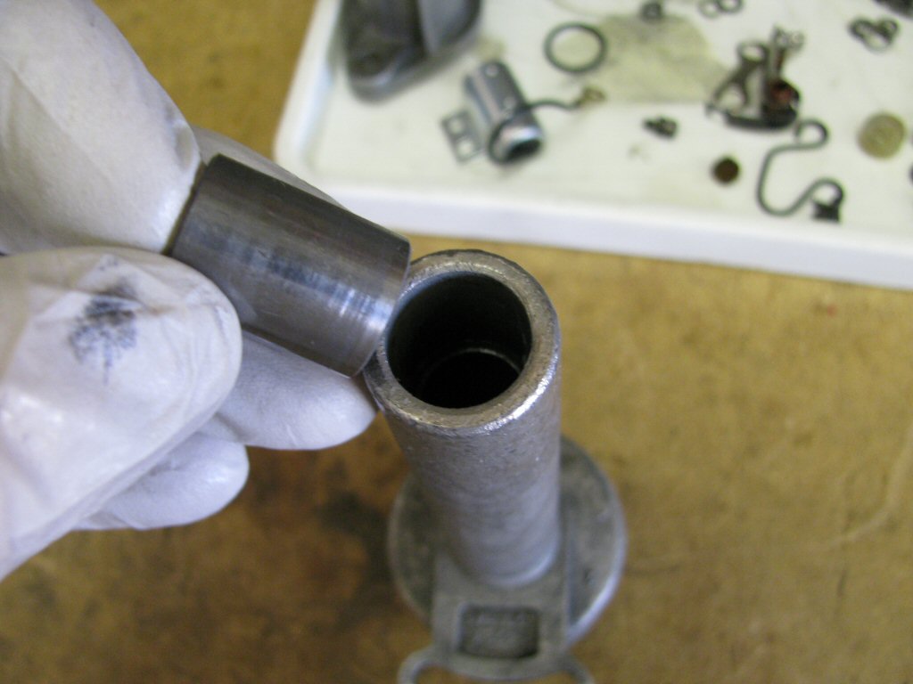 (Optional) Remove the bushing from the bottom of the distributor body.