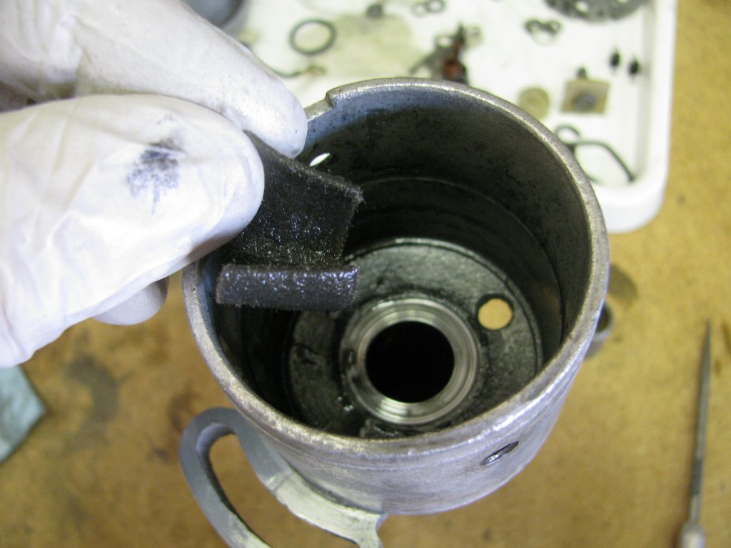 Remove the felt seal from the top of the distributor body.
