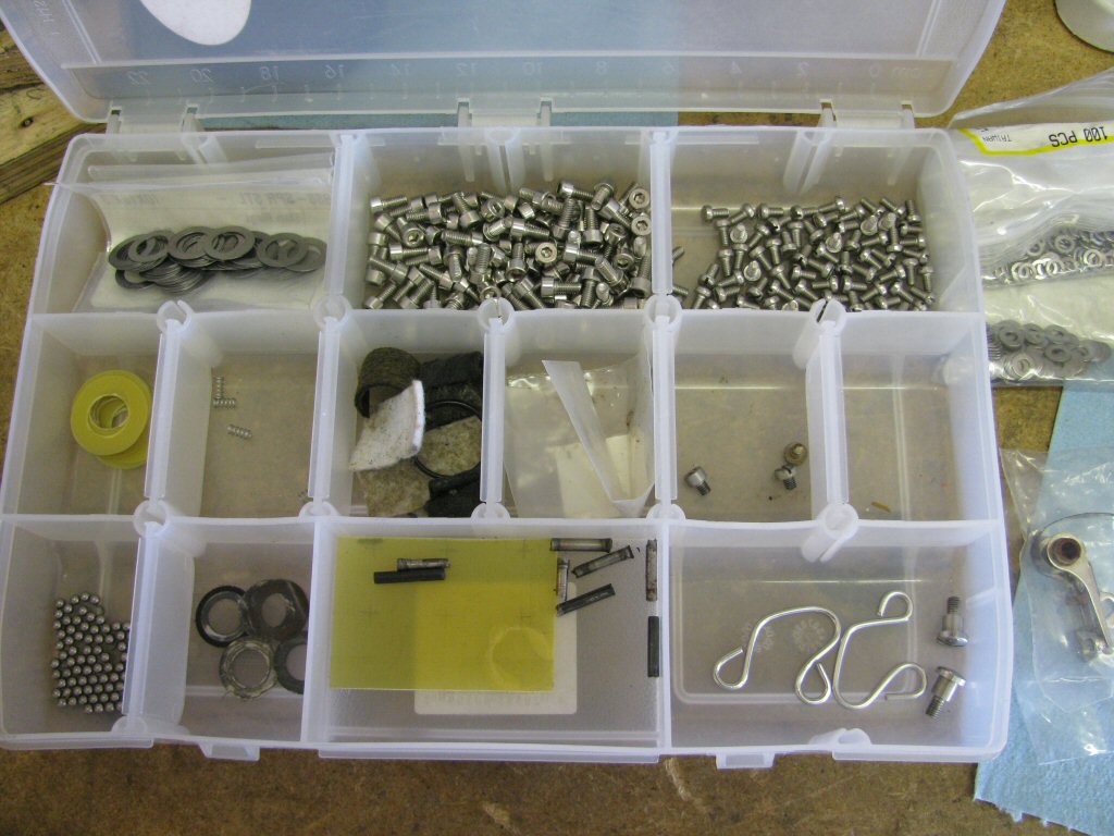 I like to replace the original fasteners with stainless replacements. Here is my lifetime supply of distributor related pieces and parts (including replacement bakelite washers!). I made the replacement bakelite washers using modern Garolite material that I purchased (McMaster-Carr part number 8667K111).