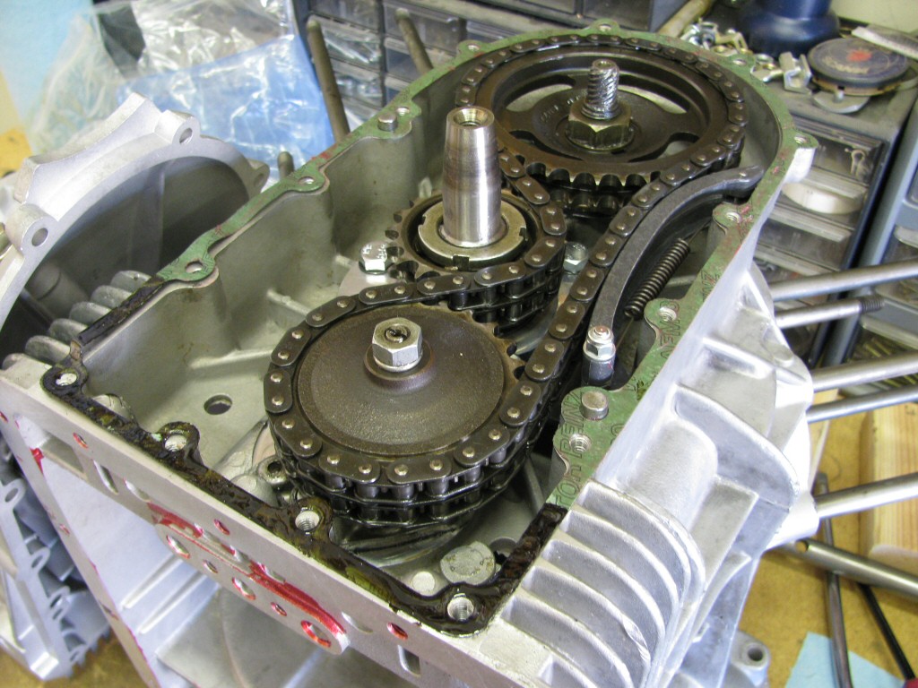 I apply Permatex Super 300 to the bottom of the timing chest gasket (up to the first bolt holes on each side). The remainder of the gasket is greased on both sides.
