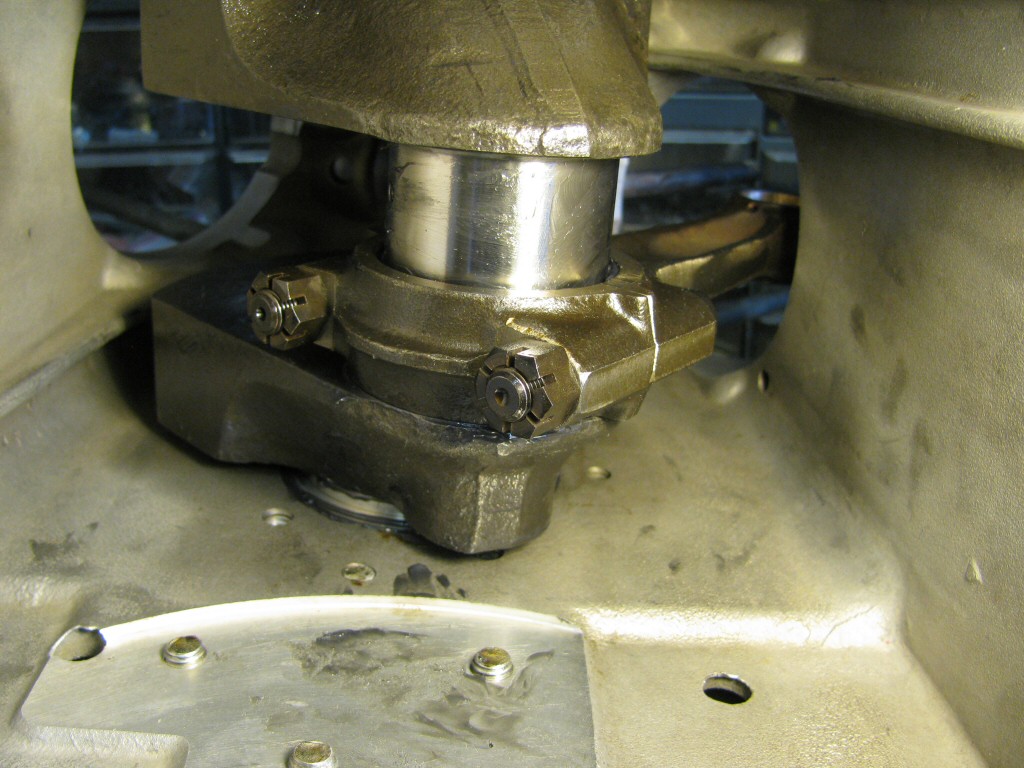 With the plastigauge removed from the crankpin, the connecting rod is fit in place with the nuts torqued.