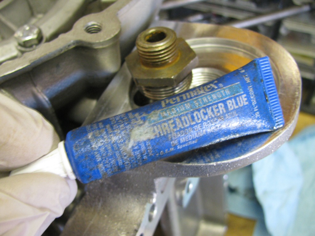 I applied blue Loctite to the oil filter adapter threads.