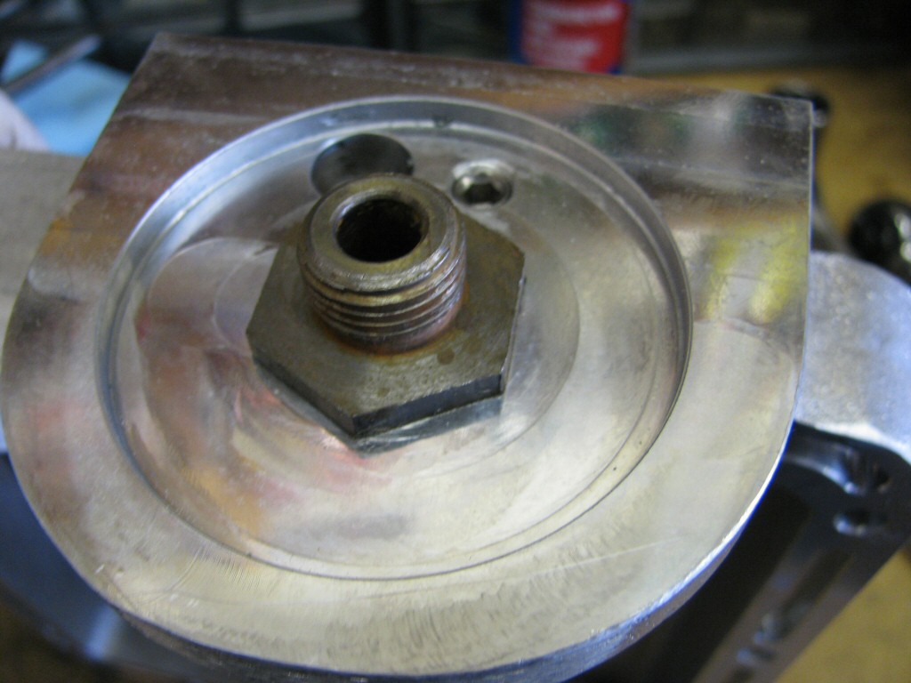 Oil filter adapter tightened in place.
