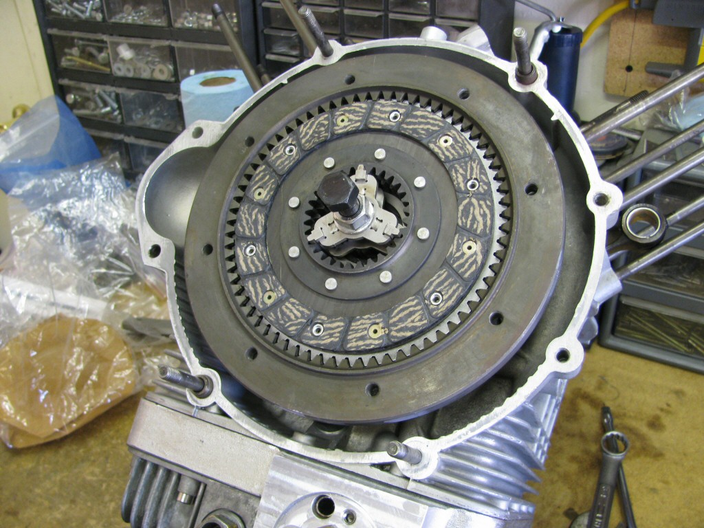 Fit another clutch plate; splines protrude toward the rear.