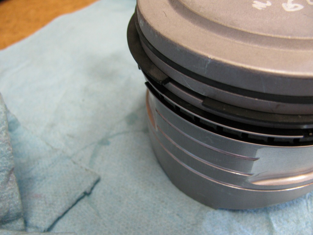 Rings fit to the left piston. This series of photos is intended to show the careful ring gap placement, as per the instructions provided by the piston ring manufacturer (TotalSeal).